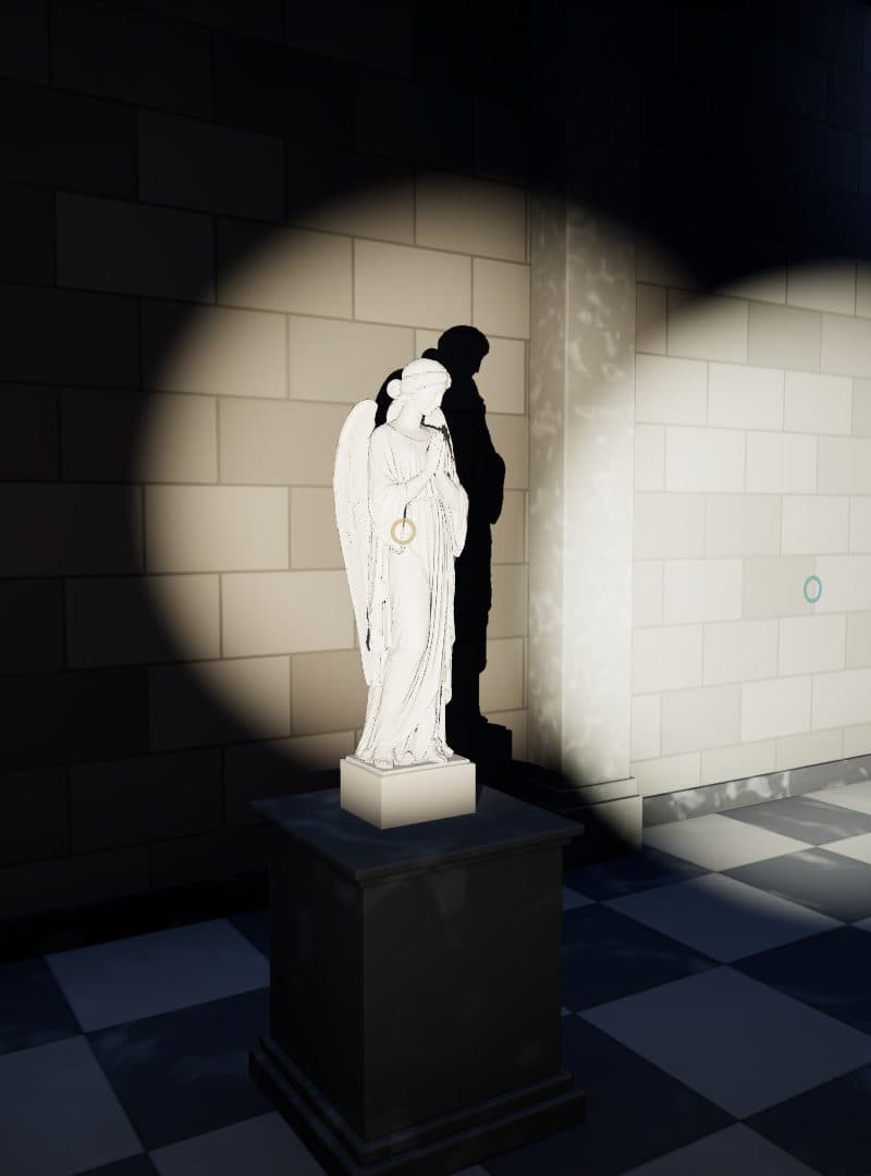 An angel statue lit up in the dark