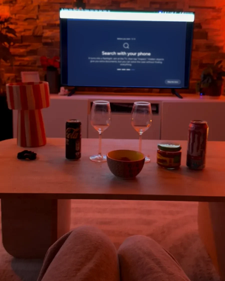 View from the couch: a blanket on the knees, the TV on