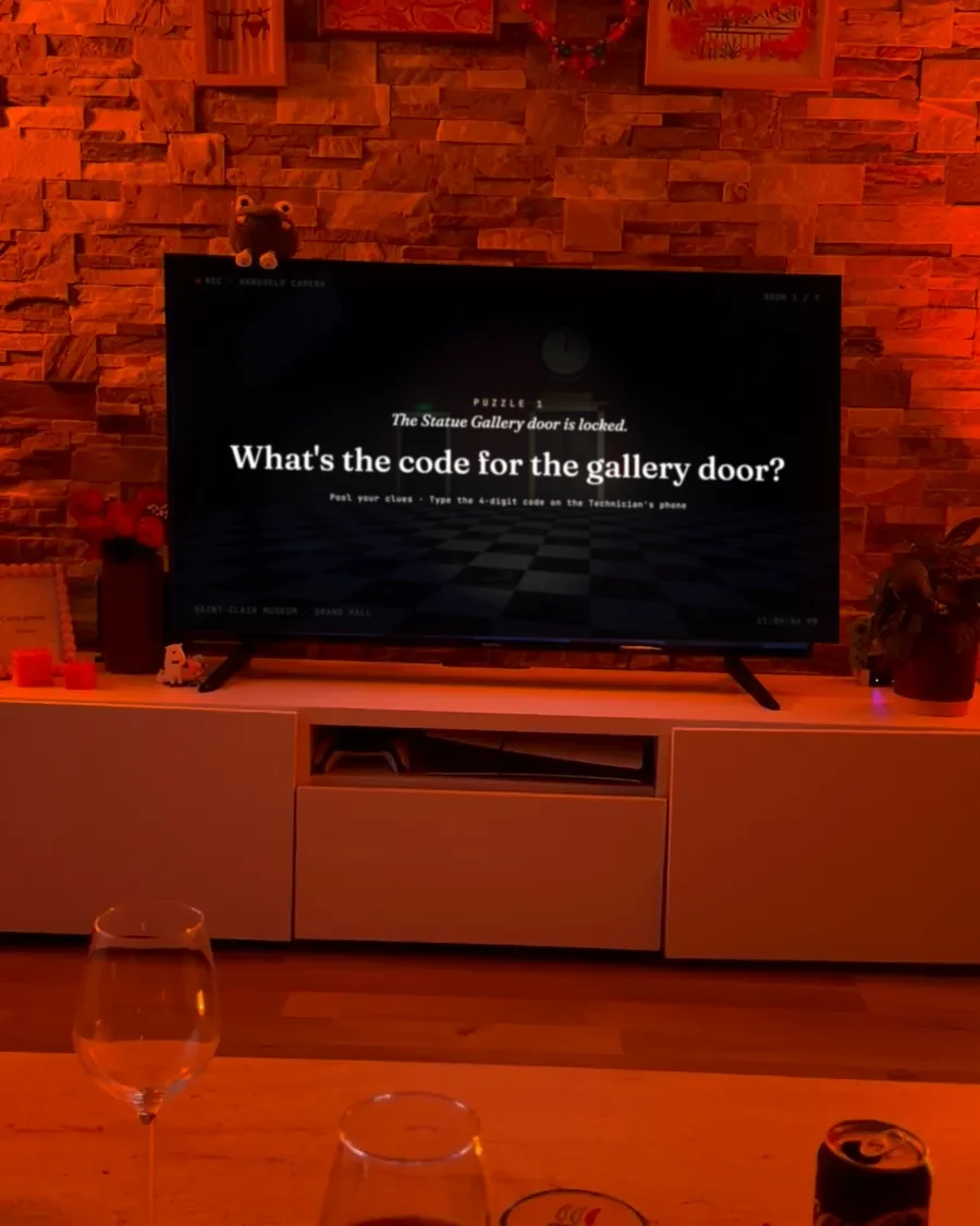 The TV shows a puzzle: find a four-digit code